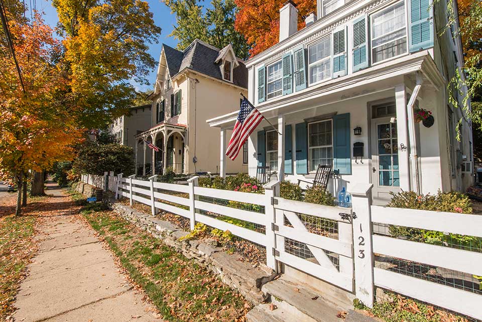 Single family homes with american flags in Chestnut Hill, Philadelphia, PA